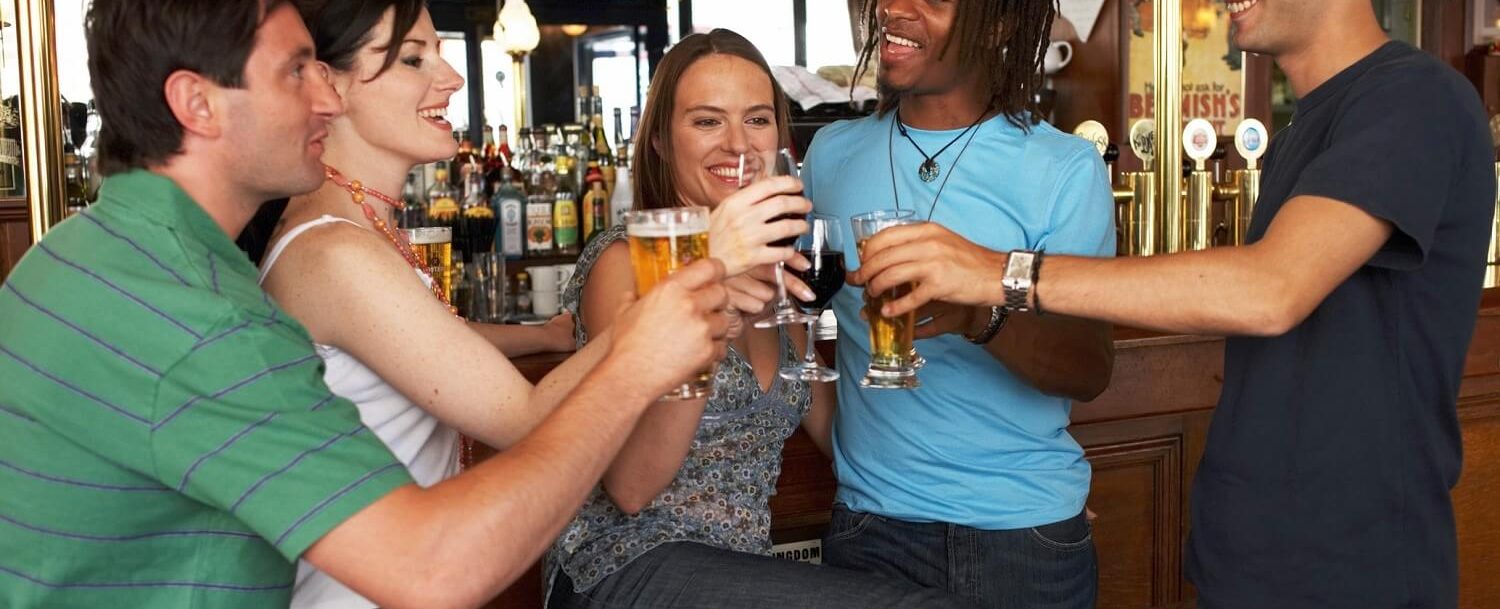 group of friends enjoying a beer at a park city bar