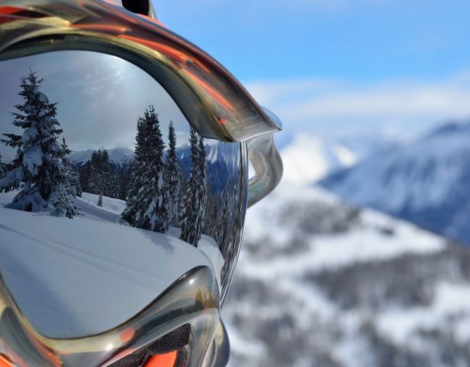 Reflection of mountain in ski goggles.